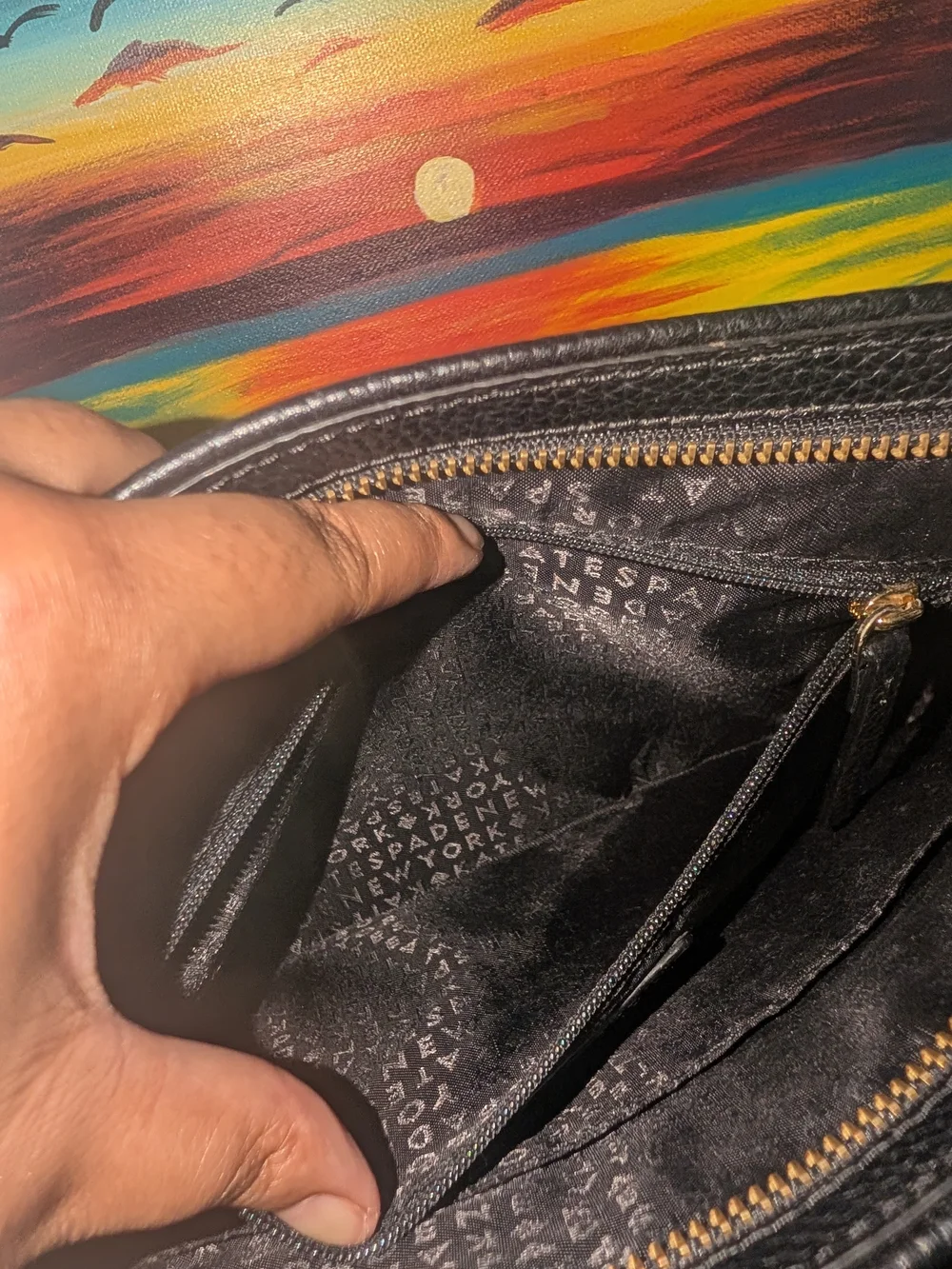 kate spade Black Pebbled Leather Crossbody with Tassel Zip Pocket